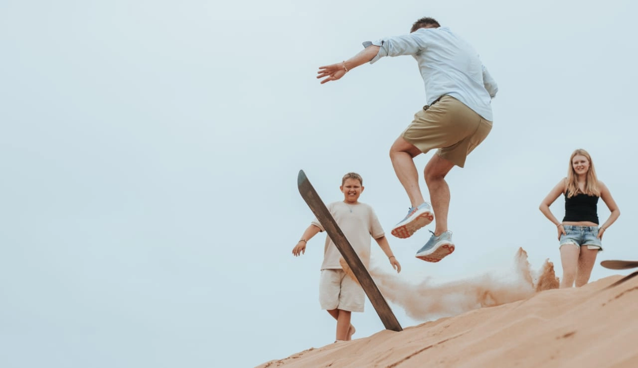 Sandboarding in Agadir dunes - Explore Timlalin Dunes
